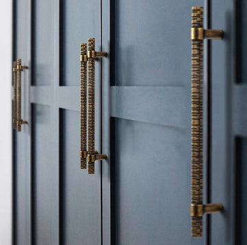 Bronze wardrobe handle with grooved texture